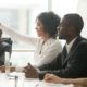 youth job/career development, education and training grants; young employee raising hand