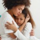children/youth impacted by domestic/sexual violence grants; mother comforting her young, sad daughter