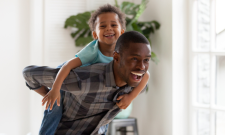 child/family welfare community program grants; happy child riding on father's back