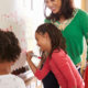 math help and education; diverse teacher and students doing math on whiteboard