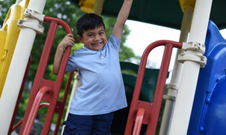 MN early child care and youth development grants; young ethnic child on playground
