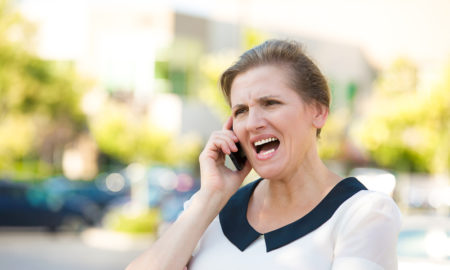 mandatory reporting: Angry Woman Screaming while Talking on mobile Phone