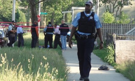 Police in Chicago, where homicides have soared recently, as they investigated a fatal shooting in May 2014 of a man in the 5700 block of South LaSalle Street.