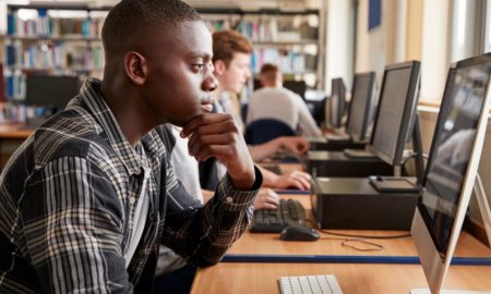 youth education, development and community grants: group of students using computers