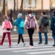 Youth violence expert how to help antisocial youth: group of school kids walking across crosswalk