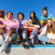 Foster care community: Group if seven teens sits on top of wall