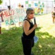 social justice grants: woman with facemask and microphone speaking in front of protest sign