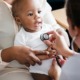 child health grants, pediatric research project grants; african american baby at doctor's office