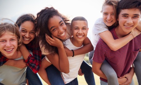 In adolescence every experience matters: group of happy youths smiling
