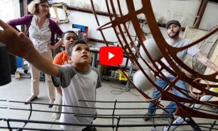 Trust time training_Unlocking potential learning ECOsystems: children look up at creative machinery in workshop